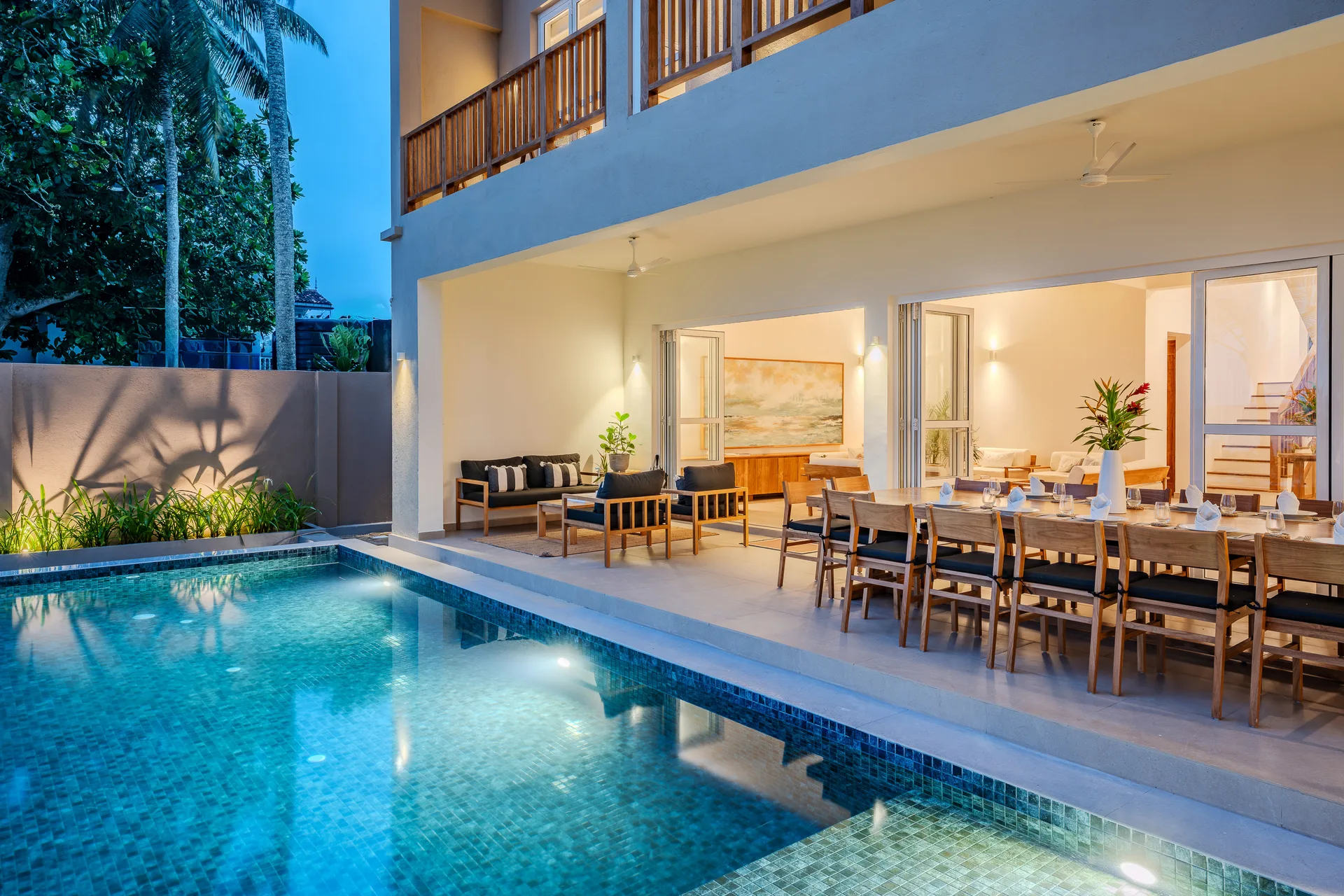 Thalpe Beach House pool and outdoor dining at evening